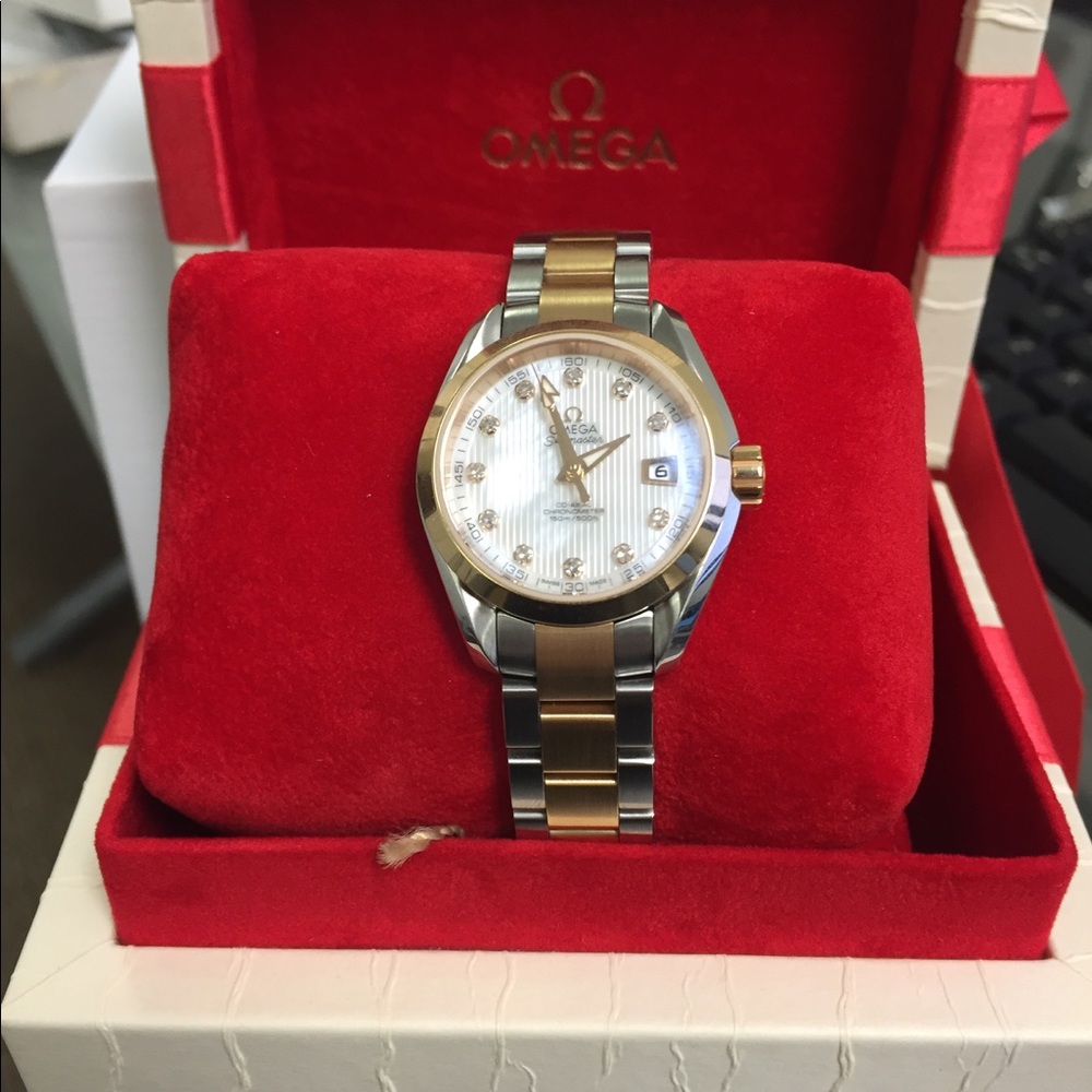 Woman's Omega Seamaster 18k gold and diamonds